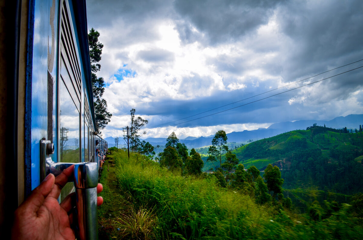 Scenic railway track from Kandy to Ella winding through tea plantations and misty hills, Sri Lanka