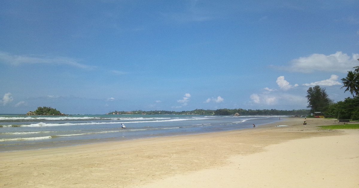 Weligama beach, a wide golden bay on Sri Lanka's south coast